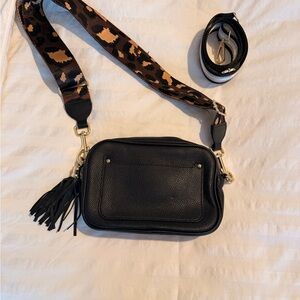 Stylish Black Crossbody Bag with Animal Print Strap
